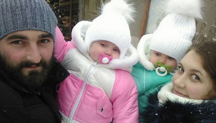Rector of St. George’s Church Fr. Nikolai Sliva with his wife and two children