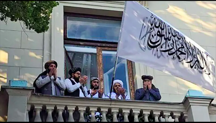 Taliban members on the balcony of the Afghan embassy in Moscow. Photo: BBC News Russian Service